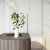 a table with a vase of flowers