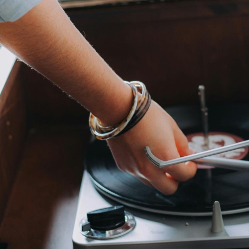 The essence of exceptional living a person playing a record